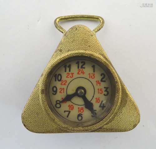 An early 20thC novelty tape measure of triangular form with an incorporated clock face with hands