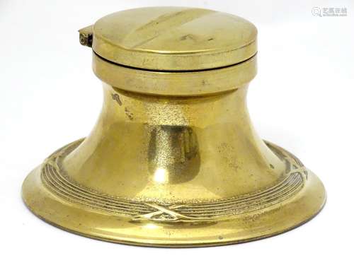 An early 20thC brass inkwell / standish with banded decoration and a glass liner. Approx. 2 1/2