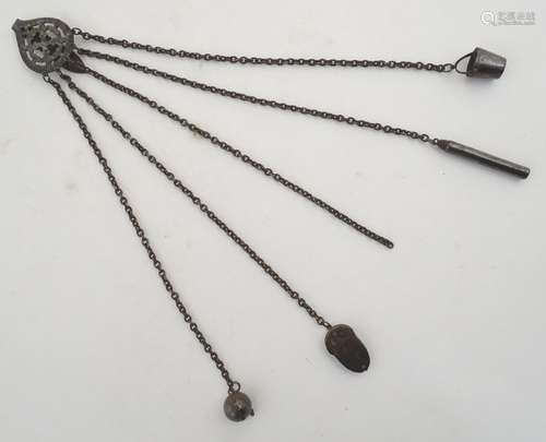 A 19thC cut steel 5 chain chatelaine with acorn shaped pin holder, tape measure, needle holder and