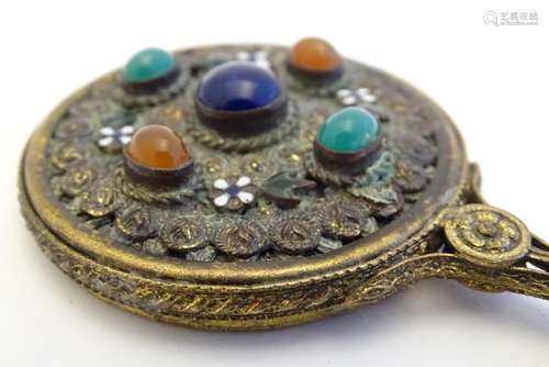 A 19thC gilt metal miniature hand mirror with applied hardstone cabochons and enamel flower