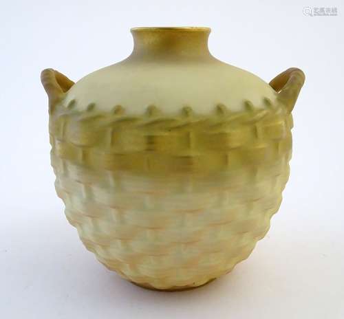 A Royal Worcester ivory ground pot formed as an osier-work twin handled basket with gilt and blush