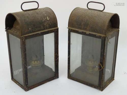 A pair of early-20thC hand oil lamps, glazed on three sides with removable burner and reservoir, the