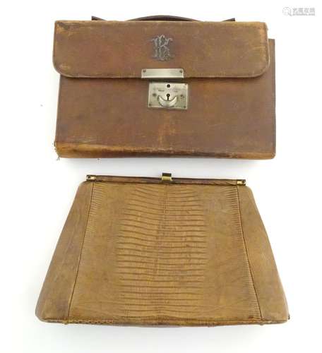 A late 19thC / early 20thC pig skin travelling vanity case of satchel form with blue leather lining,