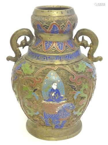 A brass Japanese vase of baluster form with Cloisonné decoration depicting a deity upon an animal