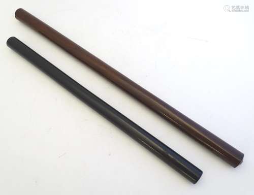 Treen: A 20thC turned walnut cylindrical rolling rule. Together with an ebony example, the ends