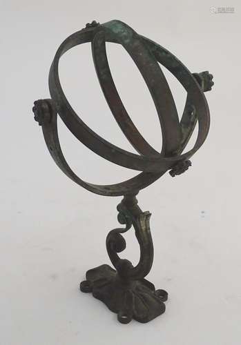 A late-19thC copper ships' compass gimbal mount, the points and fixture with rosette decoration,