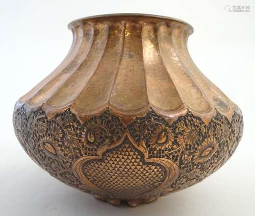 A late 19th / early 20thC copper pot / vase with hammed fluted decoration and embossed floral and