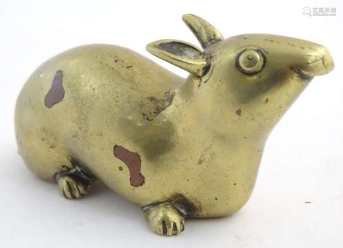 A 20thC bronze model of a rat. Approx. 2