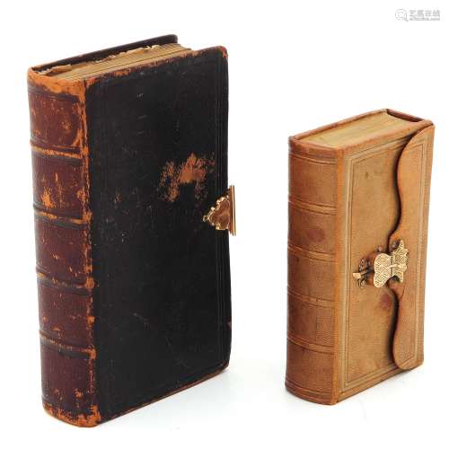 Two Bibles with Gold Clasps