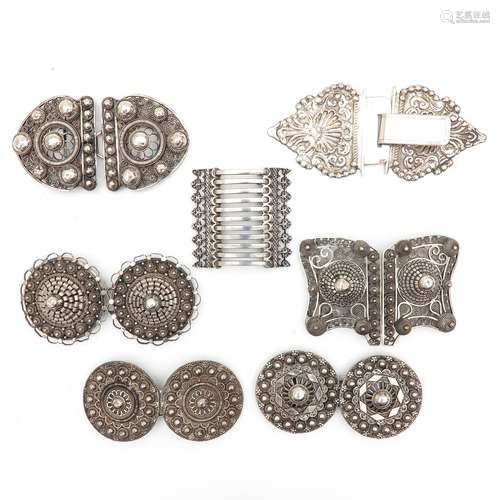 A Collection of Seven Silver Apron Clasps