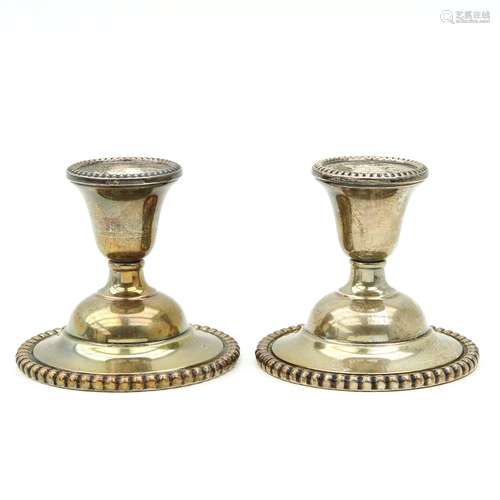 A Pair of Sterling Silver Candlesticks