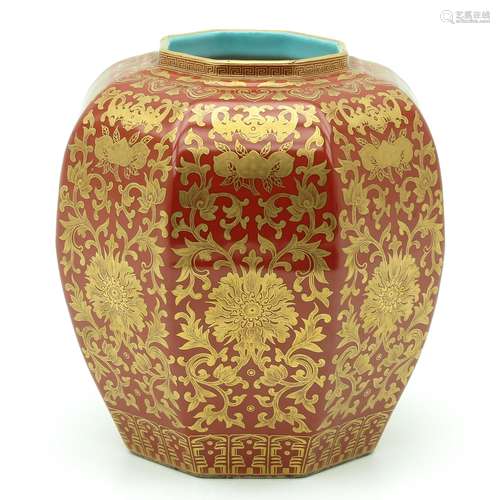 An Orange and Gilt Vase