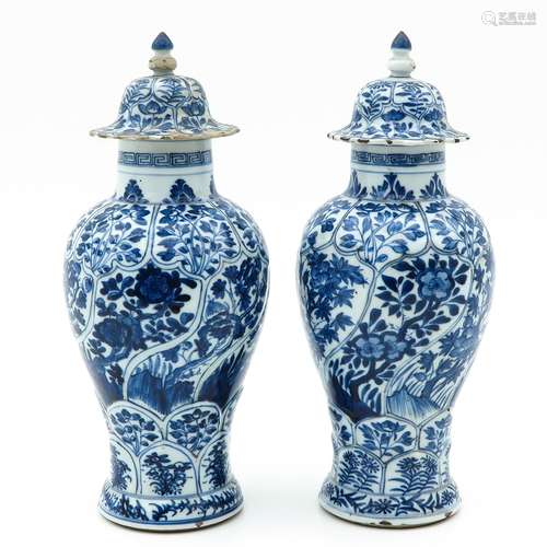 A Pair of Blue and White Covered Vases