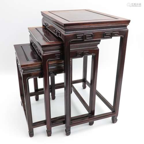 A Set of Three Carved Wood Nesting Tables