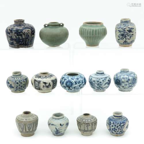 A Collection of 13 Small Stoneware Vases