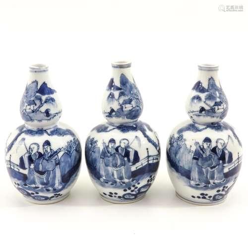 Three Blue and White Gourd Vases