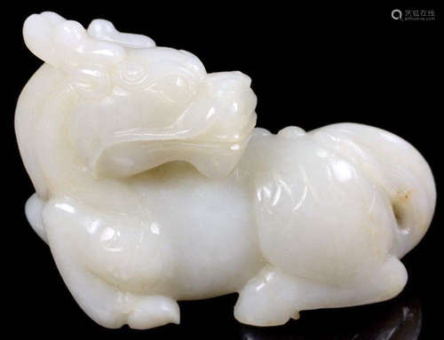 A HETIAN JADE CARVED BEAST SHAPE PENDANT