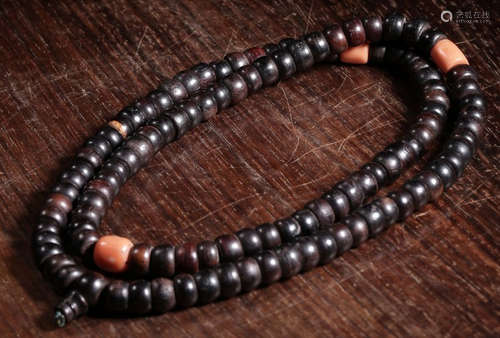 A XIAOYE ZITAN WOOD CARVED NECKLACE WITH CORAL