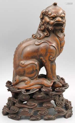 A HUANGYANG WOOD CARVED BEAST SHAPE PENDANT