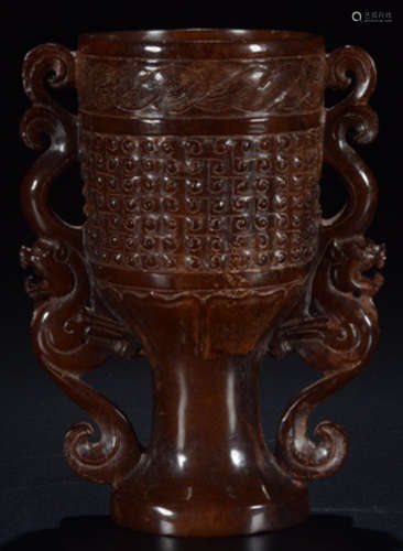 AN ANTIQUE JADE CARVED CUP WITH PATTERN
