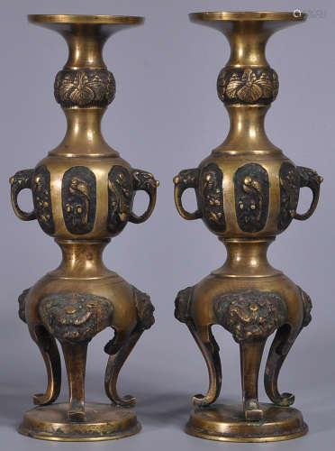 PAIR OF COPPER CASTED CANDLE HOLDERS
