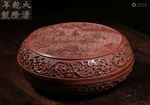 A RED LACQUER LANDSCAPE PATTERN BOX