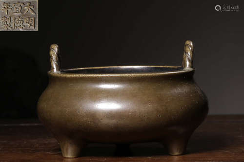 A COPPER CASTED TRIPOD CENSER