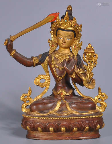 A GILT BRONZE CASTED MANJUSRI BUDDHA STATUE