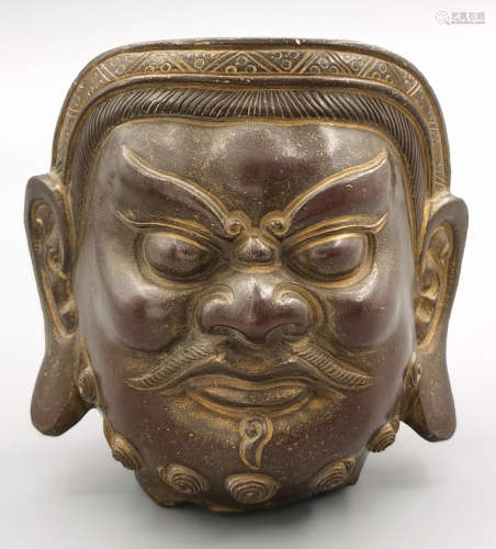 A COPPER CASTED BUDDHA HEAD PENDANT