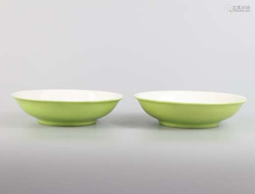 A pair of green glazed Apple saucers