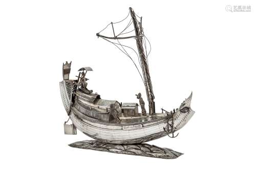 A second half of the 20th century Burmese unmarked silver model of an Irrawaddy rice boat