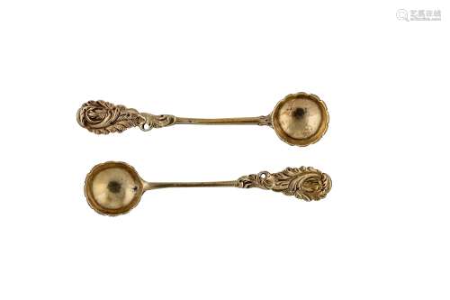 A pair of George II / George III unmarked silver gilt salt spoons, probably London circa 1760