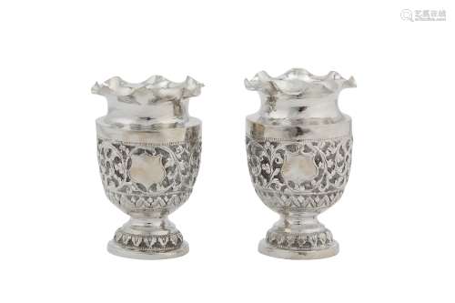 A pair of early 20th century Anglo – Indian Raj unmarked silver vases, Kutch circa 1900