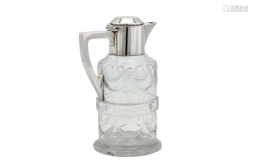A George V sterling silver mounted glass claret jug, London 1914 by Goldsmiths and Silversmiths