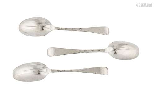 A set of three George I Britannia standard silver dessert spoons, London 1717 makers mark heavily