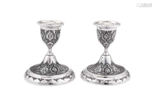 A pair of mid-20th century Iranian (Persian) unmarked silver dwarf candlesticks, Isfahan circa 1960