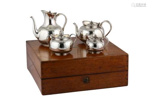 A cased Victorian sterling silver four-piece tea and coffee service, London 1874/75 by Martin Hall