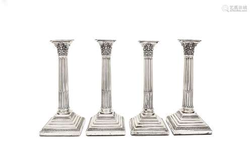 A set of four George V sterling silver candlesticks, Sheffield 1919-22 by Harrison Brothers &