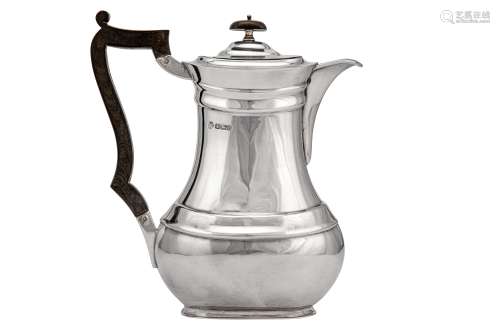 A George V sterling silver hot water pot, Sheffield 1913 by William Hutton and Son Ltd