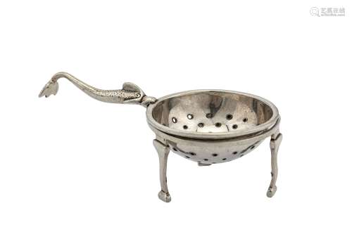 A George V Scottish sterling silver Traprain Hoard tea strainer on stand, Edinburgh 1925 by Brook