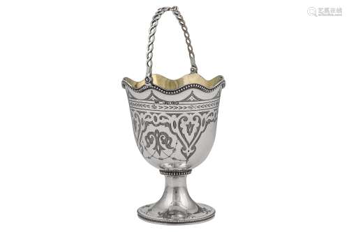 A Victorian sterling silver sugar basket, London 1867 by Henry Holland