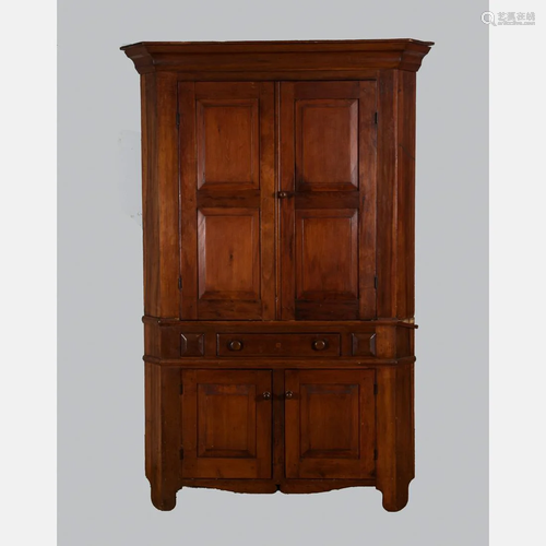 An American Pine Corner Cupboard, 19th Century.