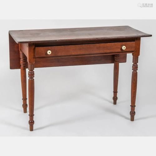 An American Pine Drop Leaf Table, 19th Century.