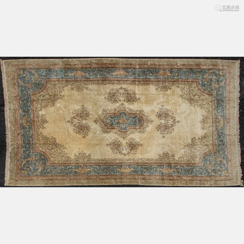 A Persian Lavar Antieh Kirman Wool Rug, 20th Century.