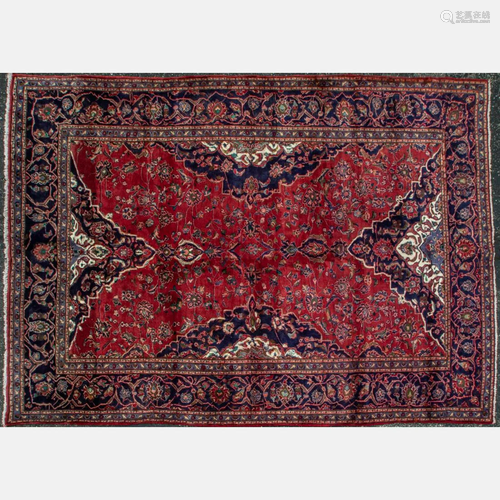 A Persian Mashad Wool Rug, 20th Century.