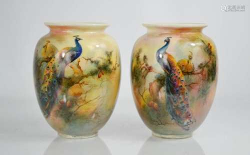 A pair of fine porcelain Royal Worcester vases, decorated with peacocks signed Sedgley, 16cm high.