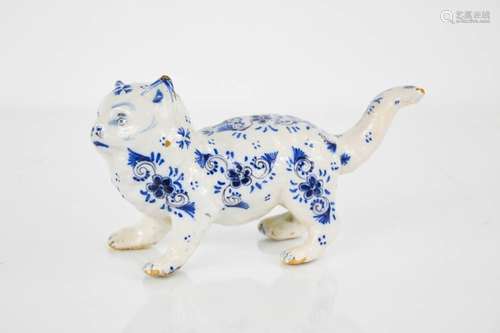 A 19th century Delft blue and white cat, 9½ cm high.