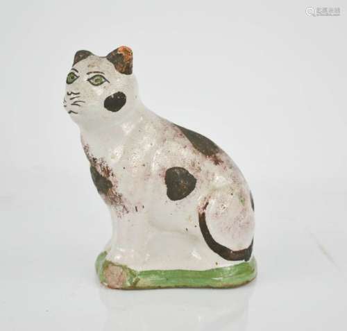 A naive terracotta faience type cat, hand painted with detail, 14cm high.