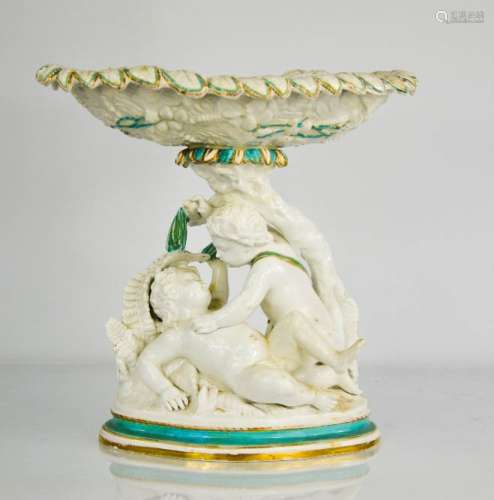 A 19th century Copeland Spode comport, modelled with cherub group, with turquoise borders. 30cms