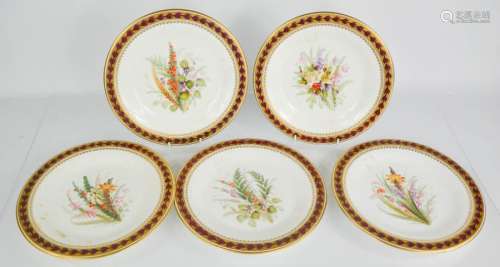 A set of five Royal Worcester plates, hand painted with flowers. 23cms diameter